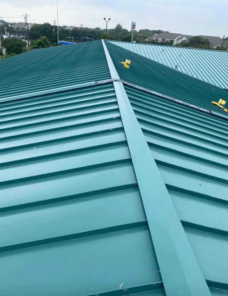 Green commercial metal roof ridge and valley for Metal Roof Repair in New Canaan